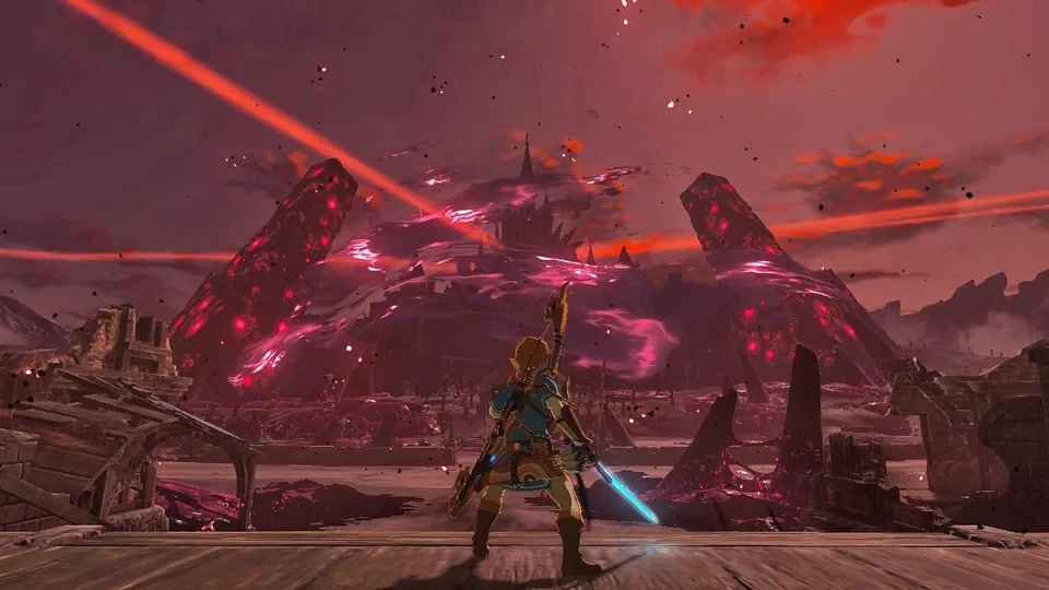 Link, épée en main, face au château d’Hyrule envahi par l’aura rouge de Ganon