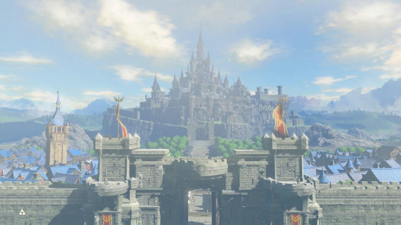 Le château d’Hyrule intact sous un ciel bleu, derrière les remparts et la ville