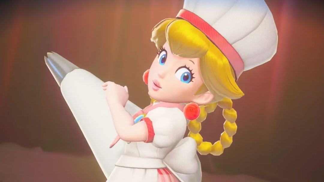 Peach en pâtissière, toque sur la tête et poche à douille géante en main