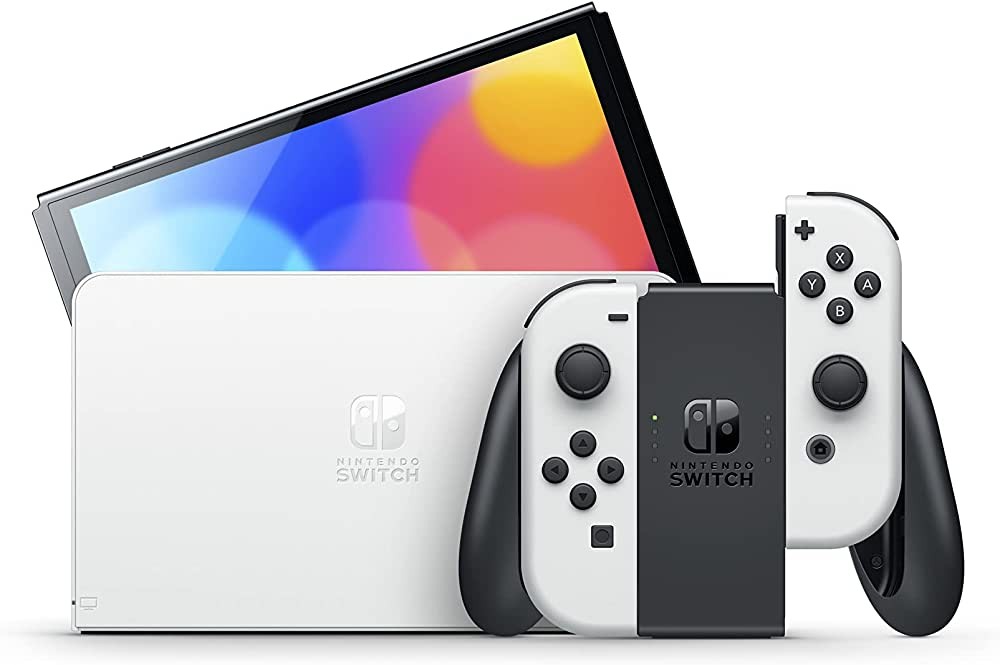 Nintendo Switch OLED blanche&nbsp;: l’écran sur sa station d’accueil et les Joy-Con sur leur support
