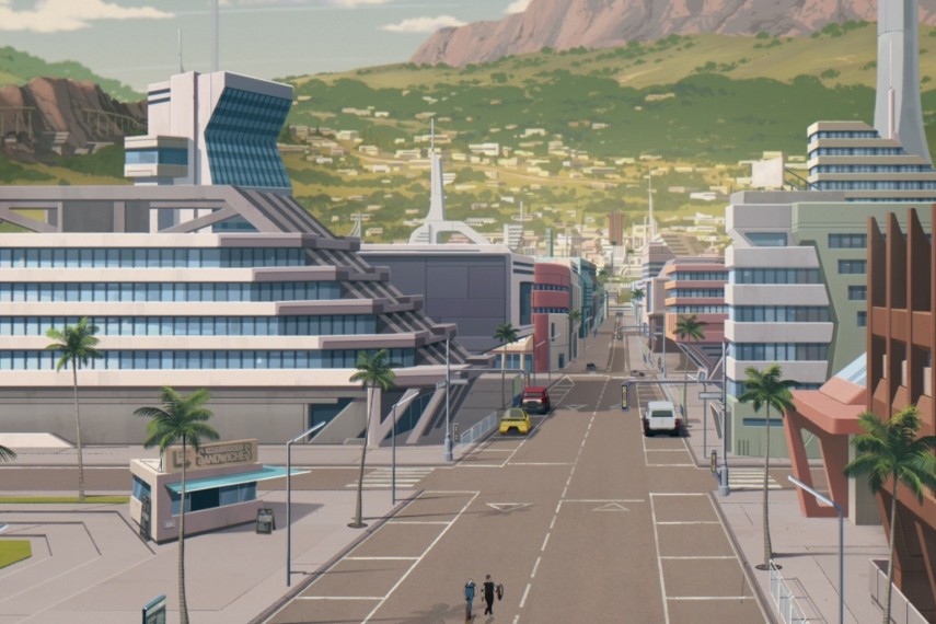 Avenue bordée de palmiers et d’immeubles futuristes au pied d’une colline