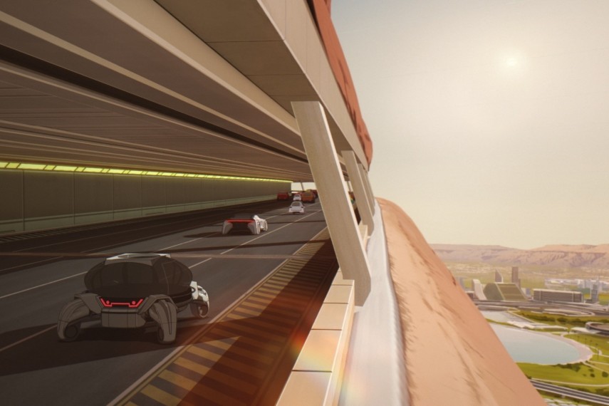 Voitures futuristes sur une route en tunnel creusée dans une falaise martienne