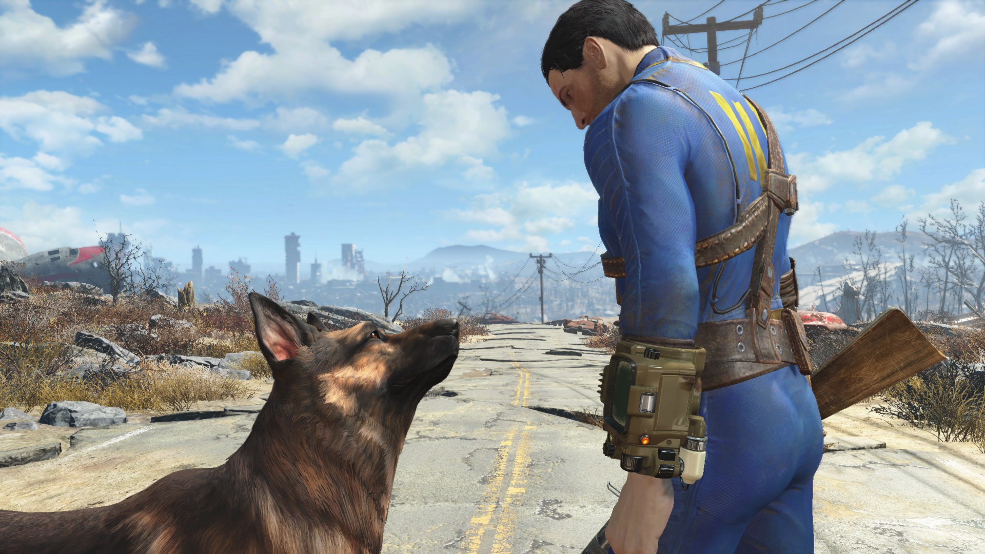Capture de Fallout 4&nbsp;: le héros en combinaison d’abri et son chien sur une route en ruines
